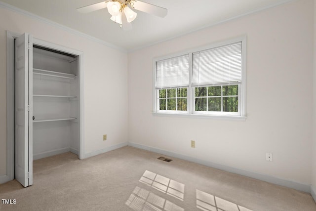6321 Malvern Ln, Hillsborough, NC 27278 - unfurnished bedroom with light carpet, ornamental molding, baseboards, a closet, and a ceiling fan