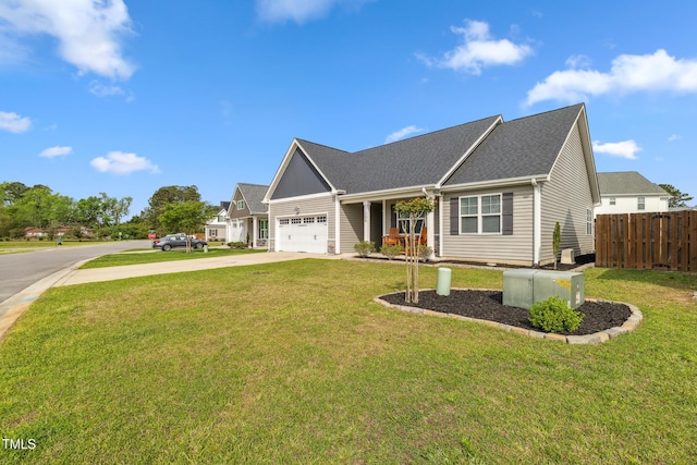 1209 Big Field Dr, Castle Hayne, NC 28429 - view of front of property featuring a front yard, a garage, fence, driveway, and roof with shingles