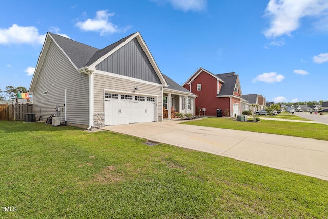 1209 Big Field Dr, Castle Hayne, NC 28429 - view of property exterior featuring central AC unit, driveway, a lawn, and a garage