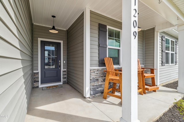 1209 Big Field Dr, Castle Hayne, NC 28429 - property entrance with stone siding and covered porch