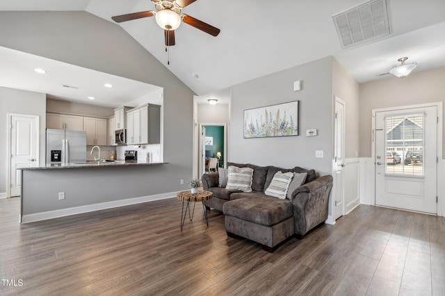 1209 Big Field Dr, Castle Hayne, NC 28429 - living area featuring ceiling fan, lofted ceiling, dark wood finished floors, and visible vents
