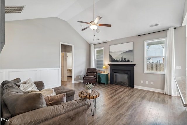 1209 Big Field Dr, Castle Hayne, NC 28429 - living area featuring visible vents, a ceiling fan, vaulted ceiling, and a glass covered fireplace