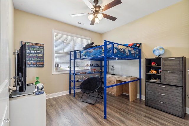 1209 Big Field Dr, Castle Hayne, NC 28429 - bedroom featuring visible vents, baseboards, a ceiling fan, and wood finished floors