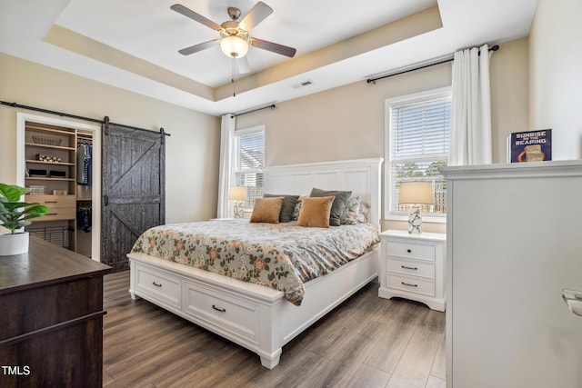 1209 Big Field Dr, Castle Hayne, NC 28429 - bedroom featuring visible vents, a raised ceiling, and a barn door
