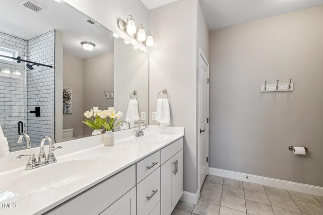 1209 Big Field Dr, Castle Hayne, NC 28429 - full bathroom featuring a sink, visible vents, toilet, and tile patterned flooring
