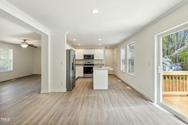 7120 Guess Rd, Hillsborough, NC 27278 - kitchen with stainless steel appliances, a healthy amount of sunlight, and light wood finished floors