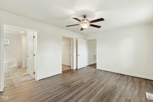 7120 Guess Rd, Hillsborough, NC 27278 - unfurnished bedroom featuring visible vents, ornamental molding, and wood finished floors