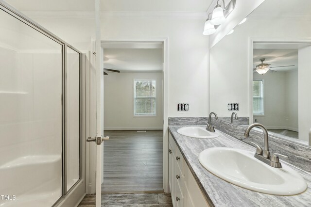 7120 Guess Rd, Hillsborough, NC 27278 - bathroom featuring ornamental molding, a stall shower, and a sink