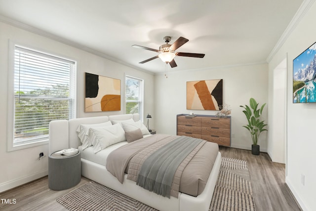 7120 Guess Rd, Hillsborough, NC 27278 - bedroom featuring ornamental molding, a ceiling fan, light wood-style flooring, and baseboards