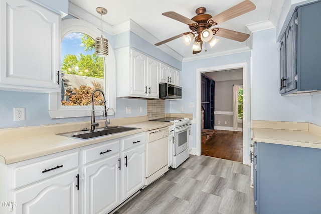3109 E Folkestone Pl, Raleigh, NC 27604 - kitchen with a ceiling fan, white dishwasher, a sink, stainless steel microwave, and stove