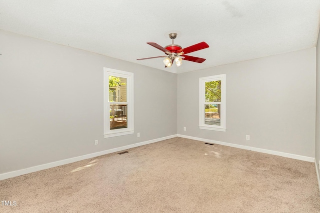 3109 E Folkestone Pl, Raleigh, NC 27604 - carpeted spare room with baseboards, a wealth of natural light, and ceiling fan
