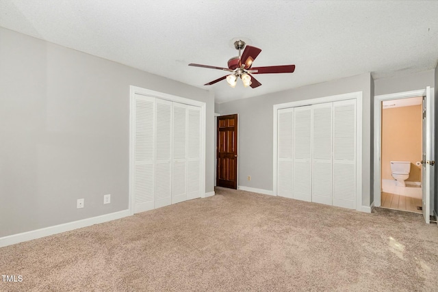 3109 E Folkestone Pl, Raleigh, NC 27604 - unfurnished bedroom with carpet floors, multiple closets, baseboards, and connected bathroom
