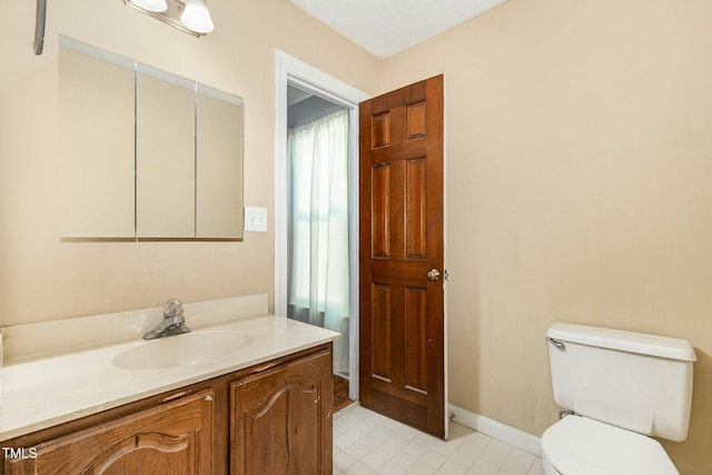 3109 E Folkestone Pl, Raleigh, NC 27604 - half bathroom with tile patterned flooring, baseboards, toilet, and vanity