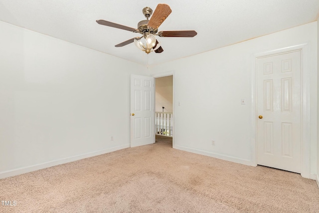 3109 E Folkestone Pl, Raleigh, NC 27604 - spare room with light carpet, a ceiling fan, and baseboards