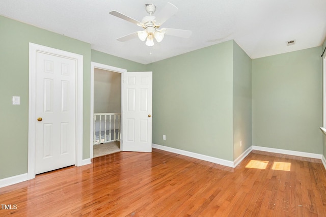 3109 E Folkestone Pl, Raleigh, NC 27604 - unfurnished bedroom with light wood-style flooring, visible vents, baseboards, and ceiling fan