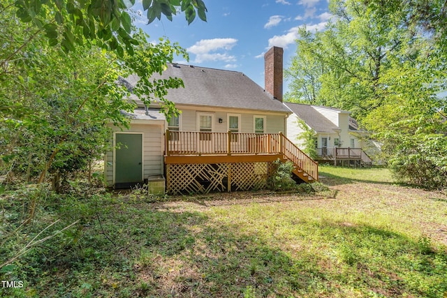3109 E Folkestone Pl, Raleigh, NC 27604 - rear view of property featuring stairway, a chimney, a shingled roof, a yard, and a deck