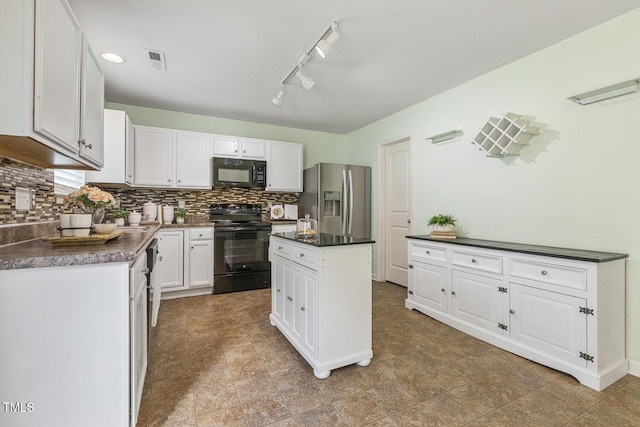 4817 Quarryman Rd, Raleigh, NC 27610 - kitchen featuring visible vents, dark countertops, white cabinetry, black appliances, and decorative backsplash