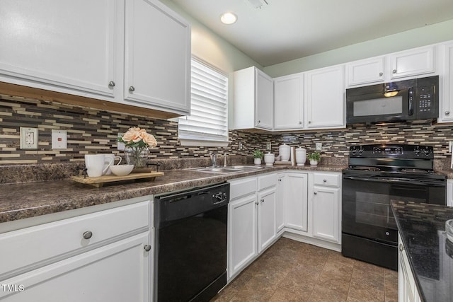 4817 Quarryman Rd, Raleigh, NC 27610 - kitchen with a sink, black appliances, dark countertops, and white cabinetry