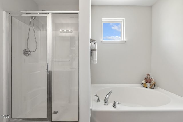 4817 Quarryman Rd, Raleigh, NC 27610 - full bathroom featuring a bath and a stall shower