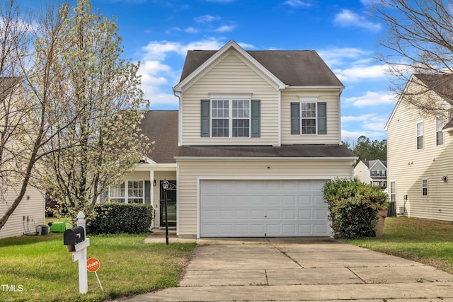 2604 Smoky Topaz Ln, Raleigh, NC 27610 - traditional-style home featuring roof with shingles, driveway, a front yard, central AC, and a garage