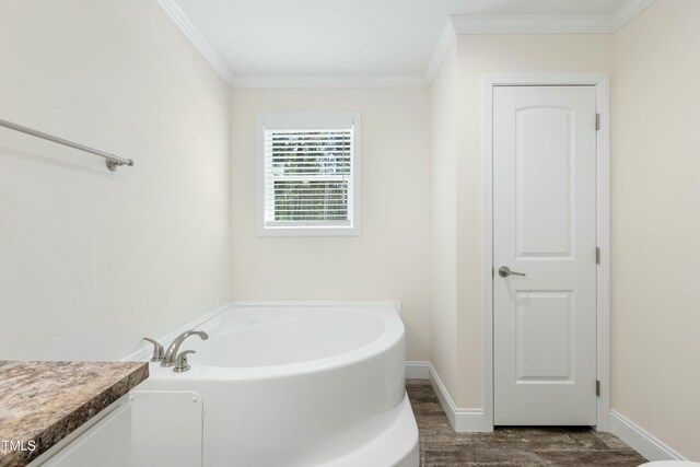7122 Guess Rd, Hillsborough, NC 27278 - bathroom featuring crown molding, a bath, wood finished floors, and baseboards