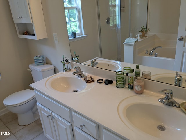 bathroom featuring a sink, tile patterned flooring, and toilet