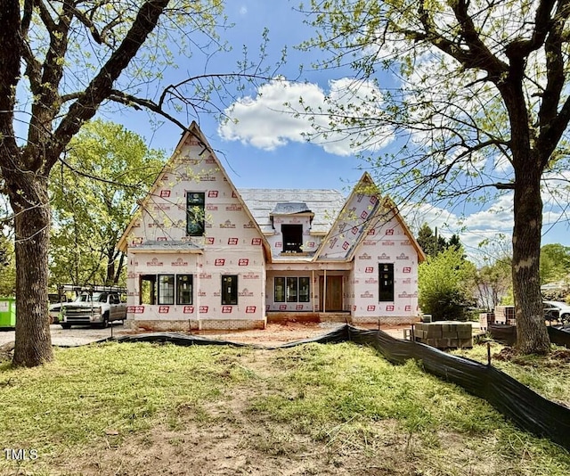 back of house with a yard