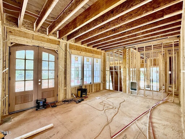 misc room with french doors and a wood stove