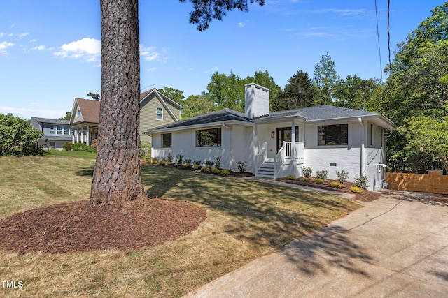 1310 Mayfair Rd, Raleigh, NC 27608 - view of front of house with a chimney, brick siding, and roof with shingles