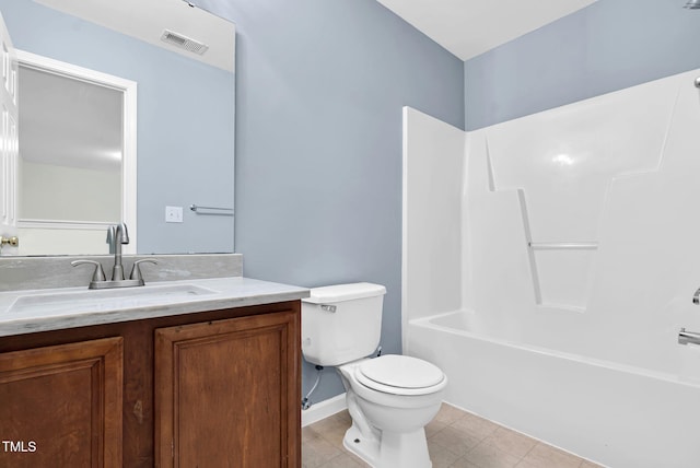 bathroom with vanity, baseboards, tile patterned floors, toilet, and visible vents