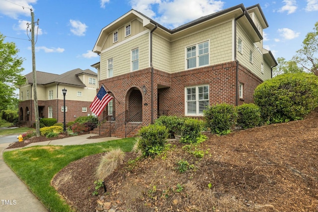 traditional-style house featuring brick siding