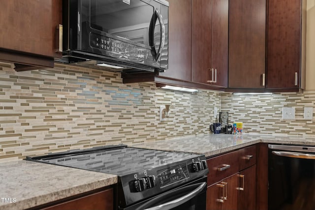 kitchen featuring dark brown cabinetry, backsplash, black appliances, and light stone counters