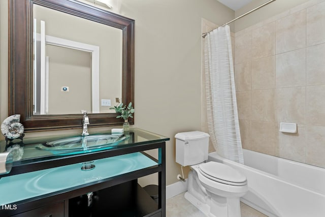 bathroom featuring shower / bath combination with curtain, toilet, baseboards, tile patterned flooring, and vanity
