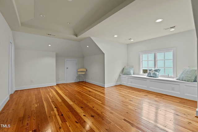 additional living space featuring light wood-style flooring, baseboards, visible vents, and recessed lighting