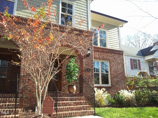 exterior space with brick siding
