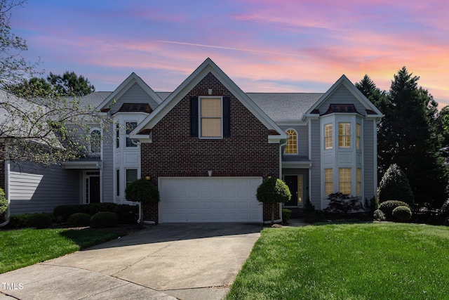 113 Beeley Ct, Cary, NC 27519 - traditional-style house featuring a front yard, driveway, brick siding, and a garage