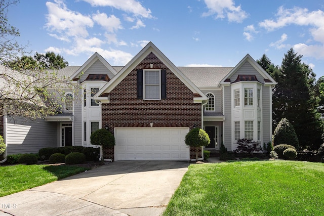 113 Beeley Ct, Cary, NC 27519 - traditional-style house featuring brick siding, a front yard, an attached garage, and driveway