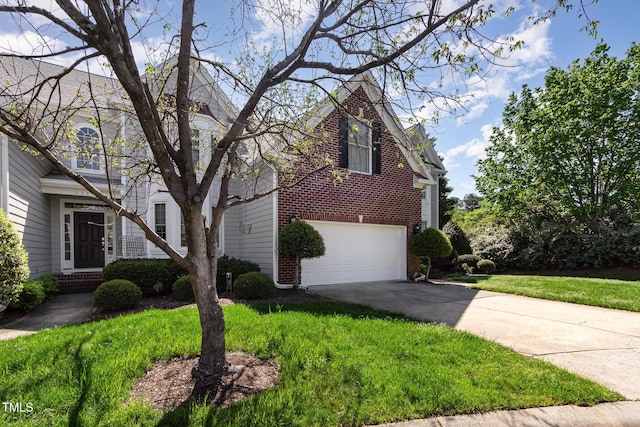 113 Beeley Ct, Cary, NC 27519 - view of front of home with brick siding, driveway, and a garage