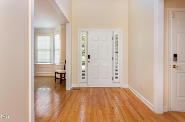 113 Beeley Ct, Cary, NC 27519 - foyer entrance featuring visible vents, light wood-type flooring, and baseboards