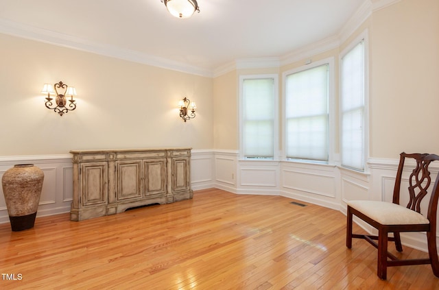 113 Beeley Ct, Cary, NC 27519 - unfurnished room with light wood-style floors, a decorative wall, wainscoting, and visible vents