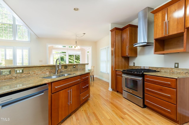 113 Beeley Ct, Cary, NC 27519 - kitchen with a sink, wall chimney range hood, appliances with stainless steel finishes, a healthy amount of sunlight, and light wood finished floors