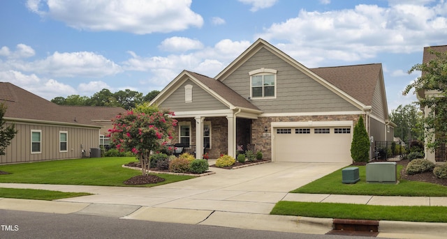1005 Vesper Ct, Durham, NC 27703 - craftsman-style house featuring a porch, concrete driveway, a front yard, stone siding, and central air condition unit