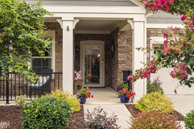 1005 Vesper Ct, Durham, NC 27703 - property entrance featuring stone siding and covered porch