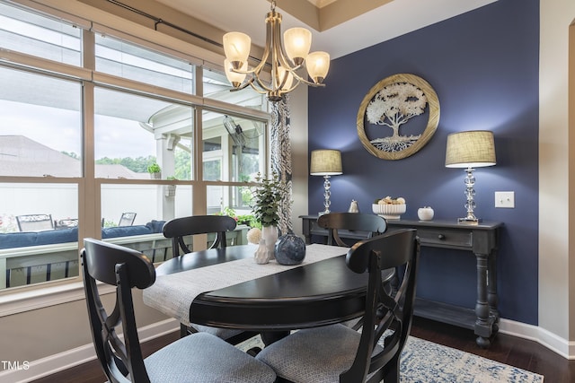 1005 Vesper Ct, Durham, NC 27703 - dining room with baseboards, a chandelier, and wood finished floors