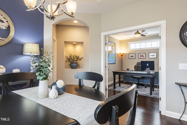 1005 Vesper Ct, Durham, NC 27703 - dining space featuring arched walkways, a chandelier, wood finished floors, baseboards, and a desk