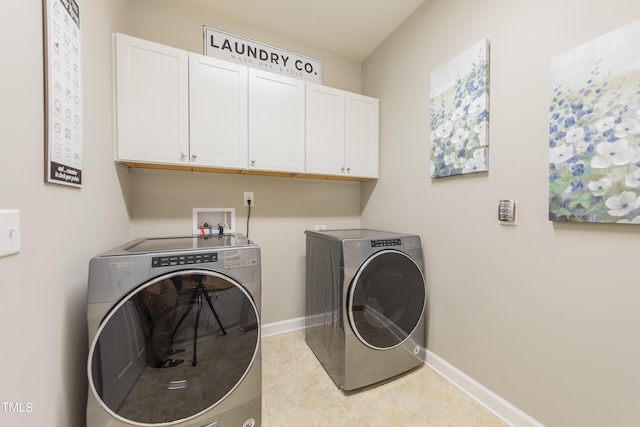 1005 Vesper Ct, Durham, NC 27703 - laundry room featuring cabinet space, washer and clothes dryer, baseboards, and light tile patterned floors