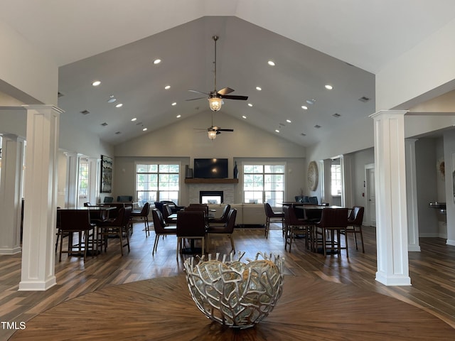 1005 Vesper Ct, Durham, NC 27703 - living area with ornate columns, high vaulted ceiling, ceiling fan, a fireplace, and recessed lighting