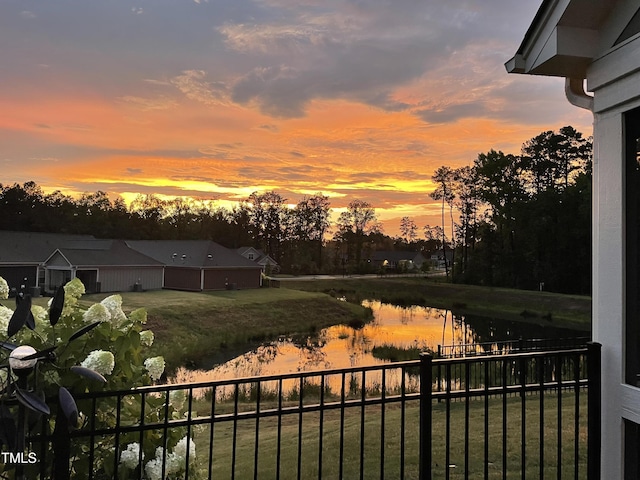 1005 Vesper Ct, Durham, NC 27703 - yard at dusk featuring fence and a water view