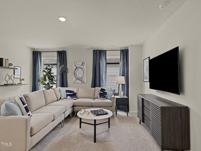 3841 Rosebush Dr, Zebulon, NC 27597 - living room featuring light colored carpet and recessed lighting