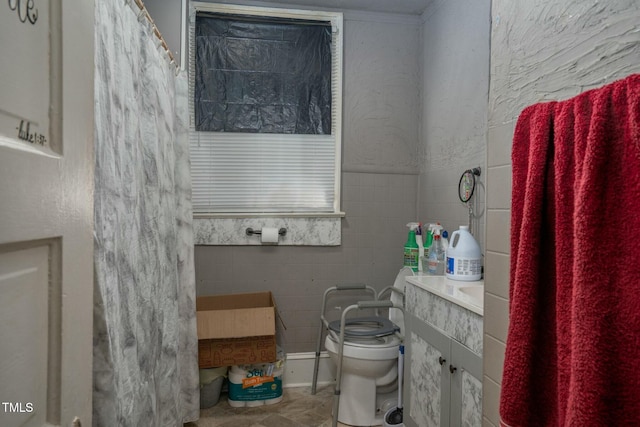 full bath with tile walls and toilet